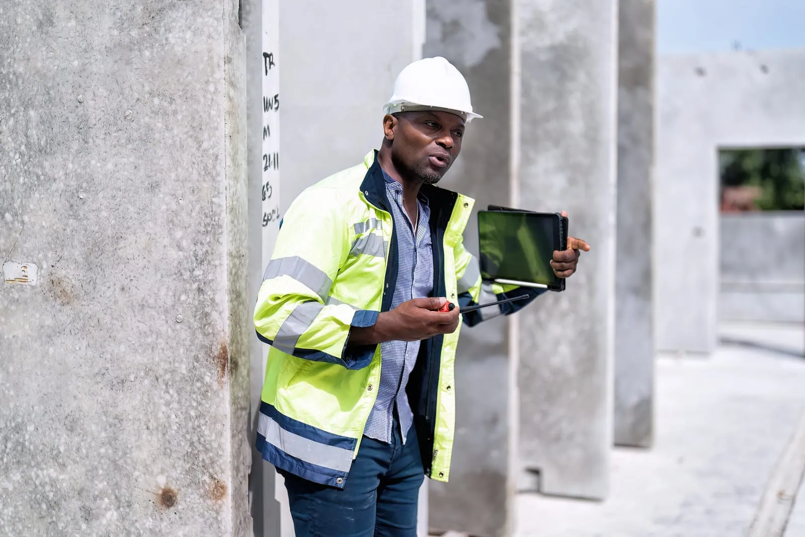 Engineer checking quality at a building construction site