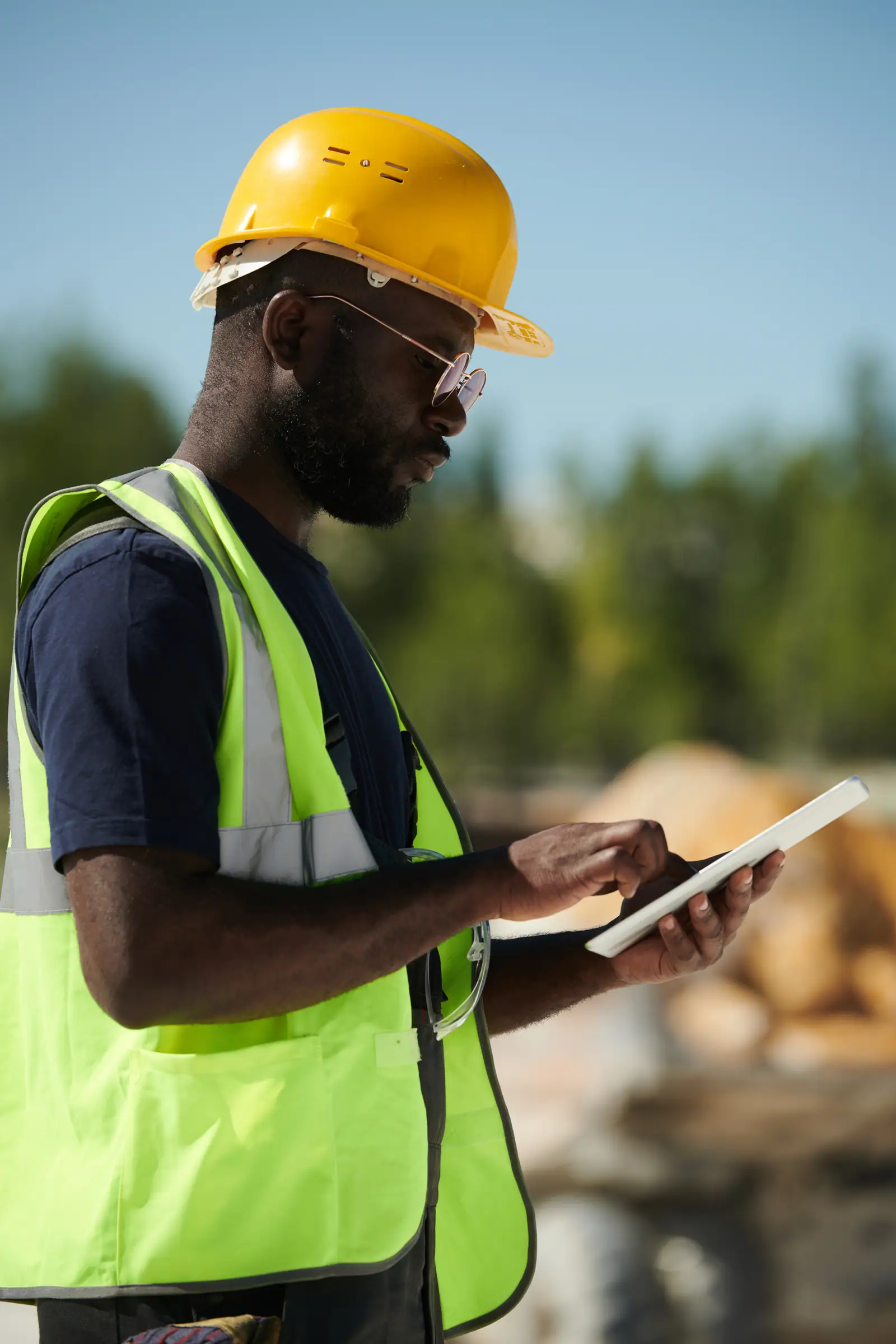 Site engineer reviewing data on a tablet