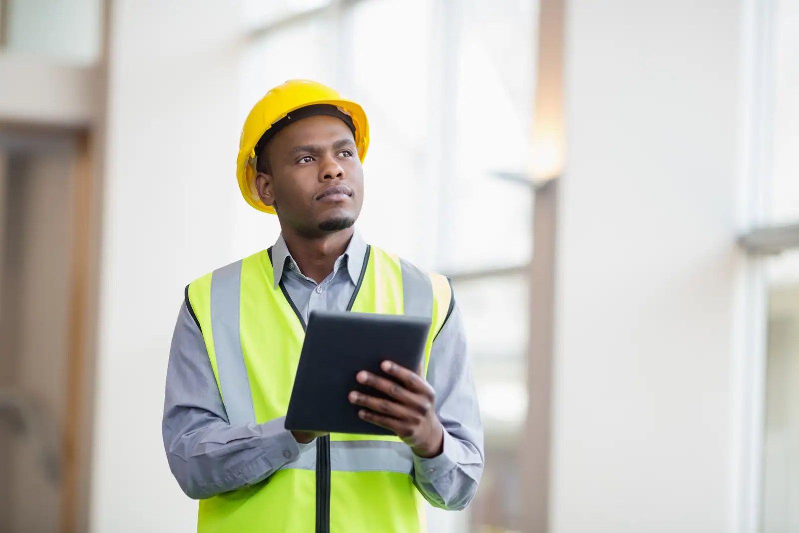 Site manager recording the day's work on a tablet