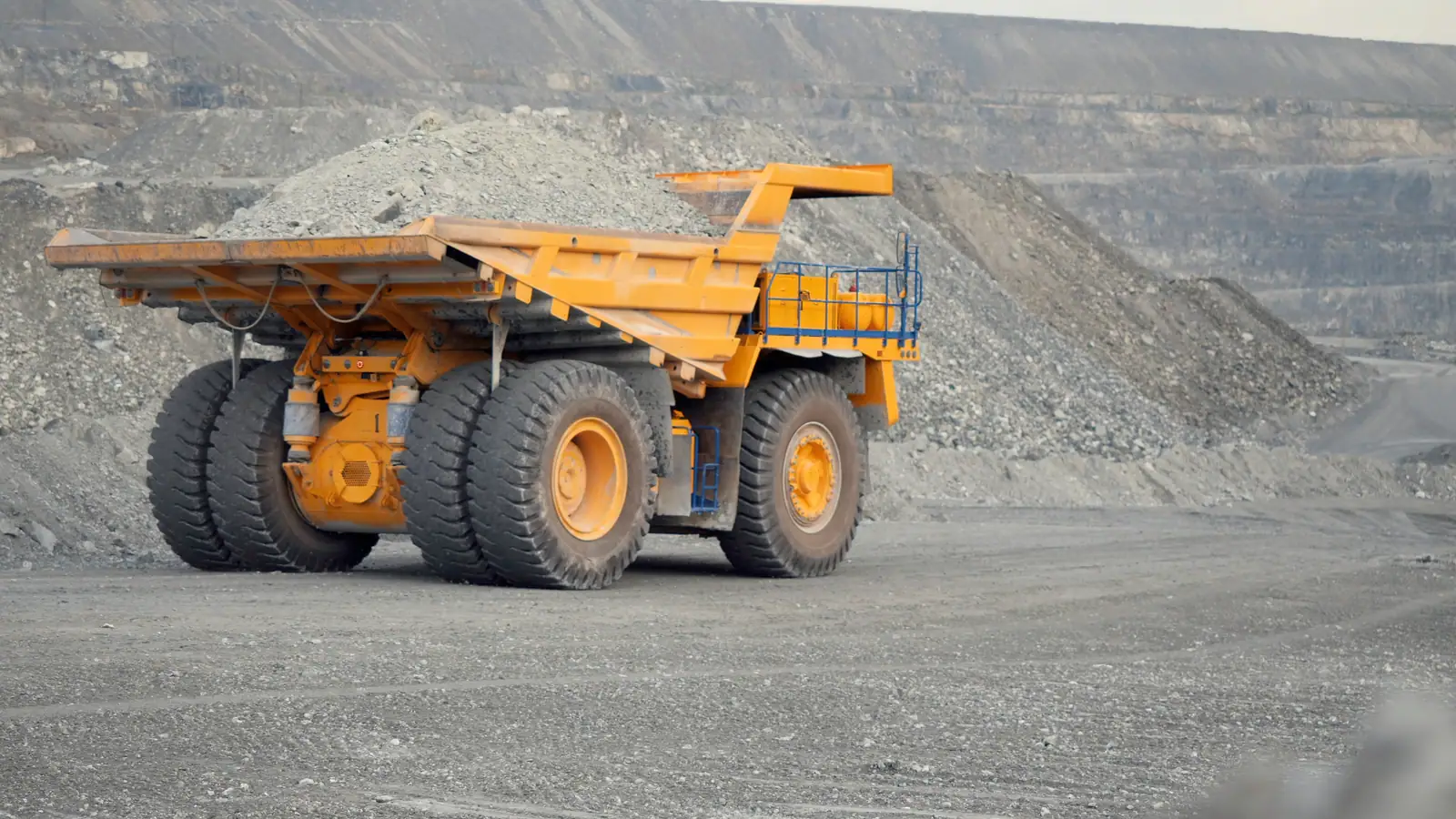 Rigid dump truck on a haul road at a Ghana mine