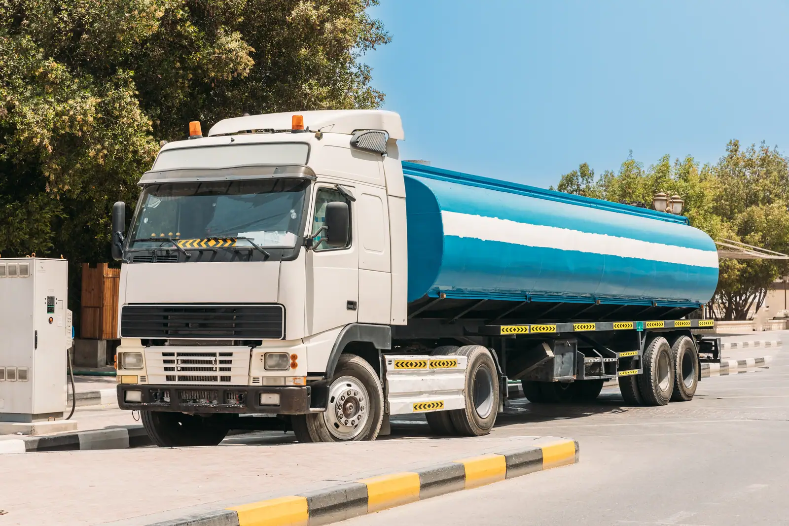 Diesel bowser refuelling heavy plant at a remote Ghana site