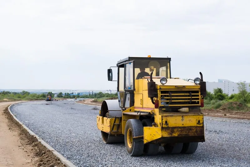 Road rollers working on a new road construction project