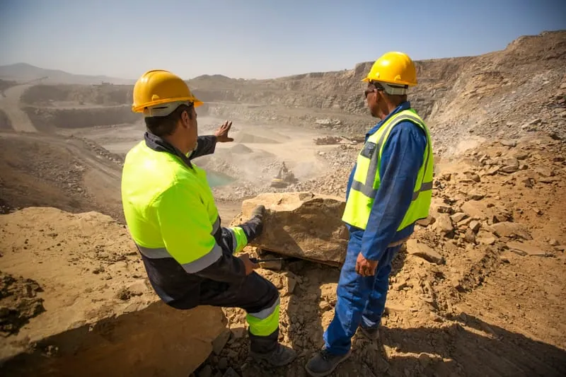 Two managers overlooking a construction site