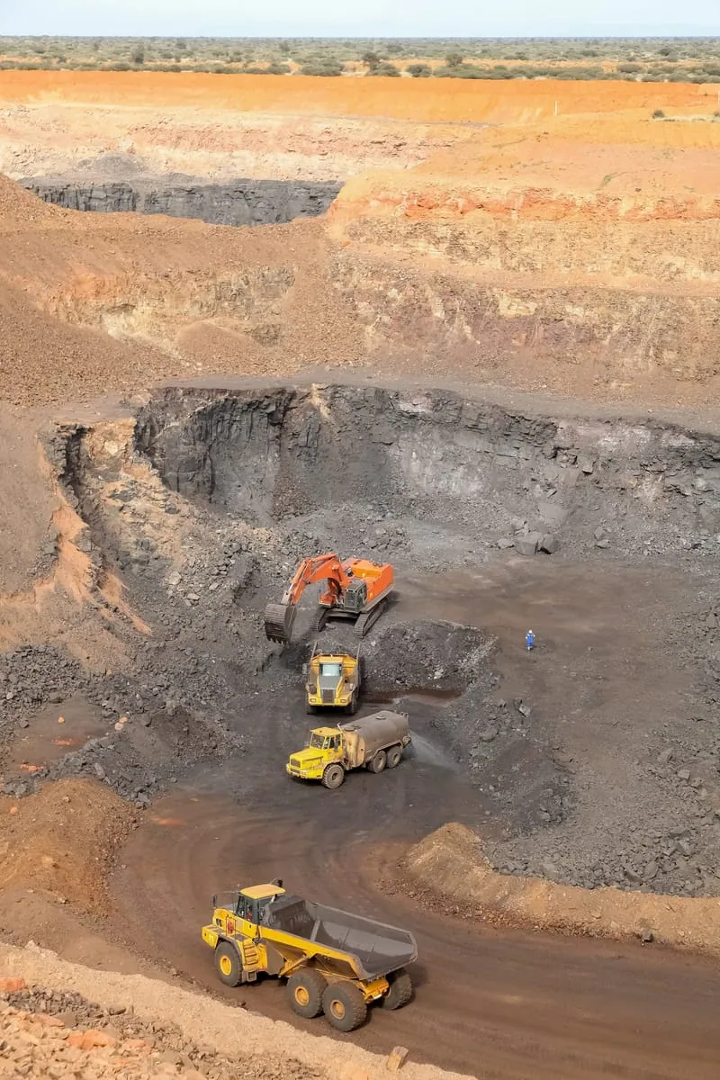 Open-pit mine with heavy machinery at work in Ghana