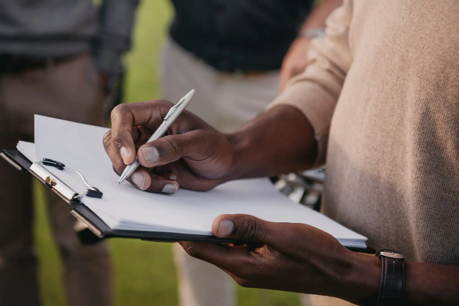 Site operator recording machine and fuel details by hand at the event