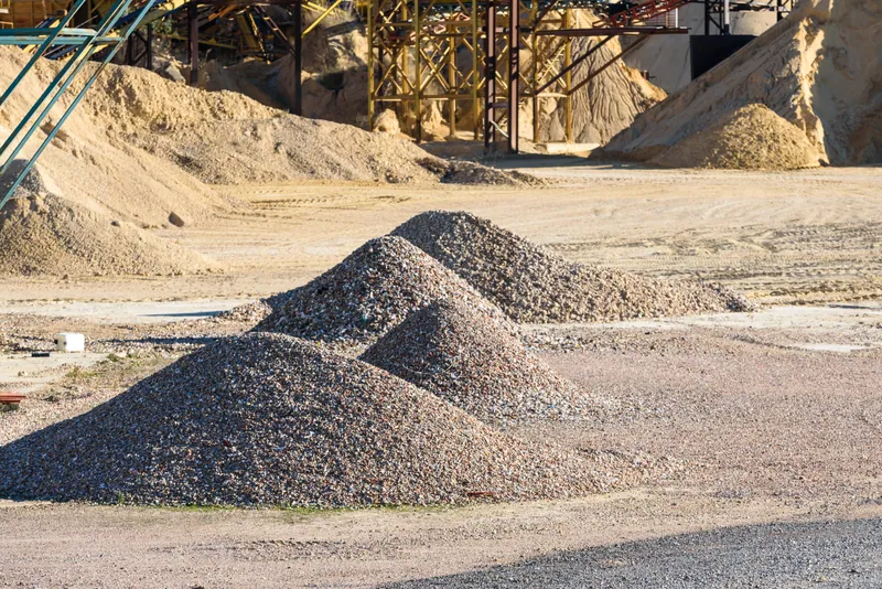 Sand and aggregate stockpiles on a Ghana construction site