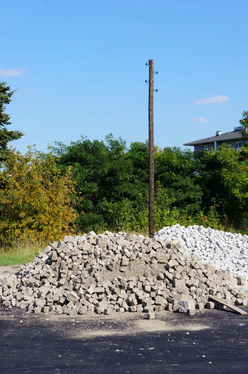 Crushed stone stockpiled on a Ghana construction package