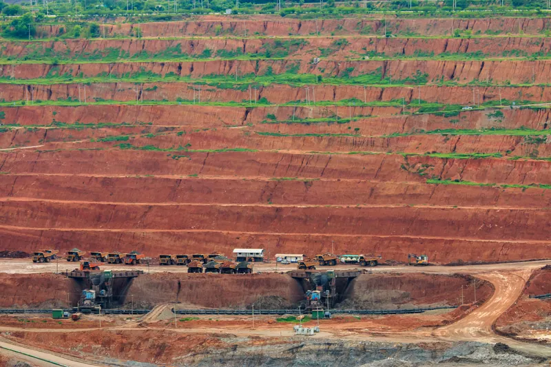 Loaded haul truck on a Ghana gold mine haul road