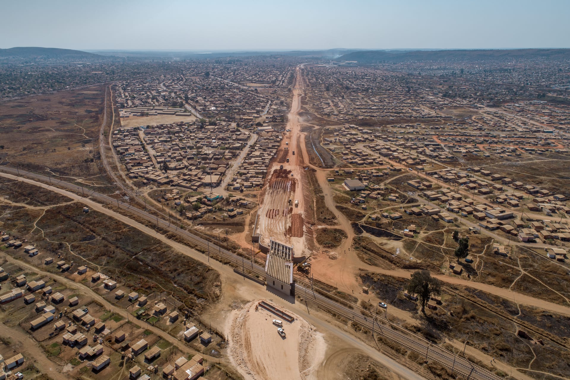 Civils and roadworks operation in Ghana with grader and supervisor