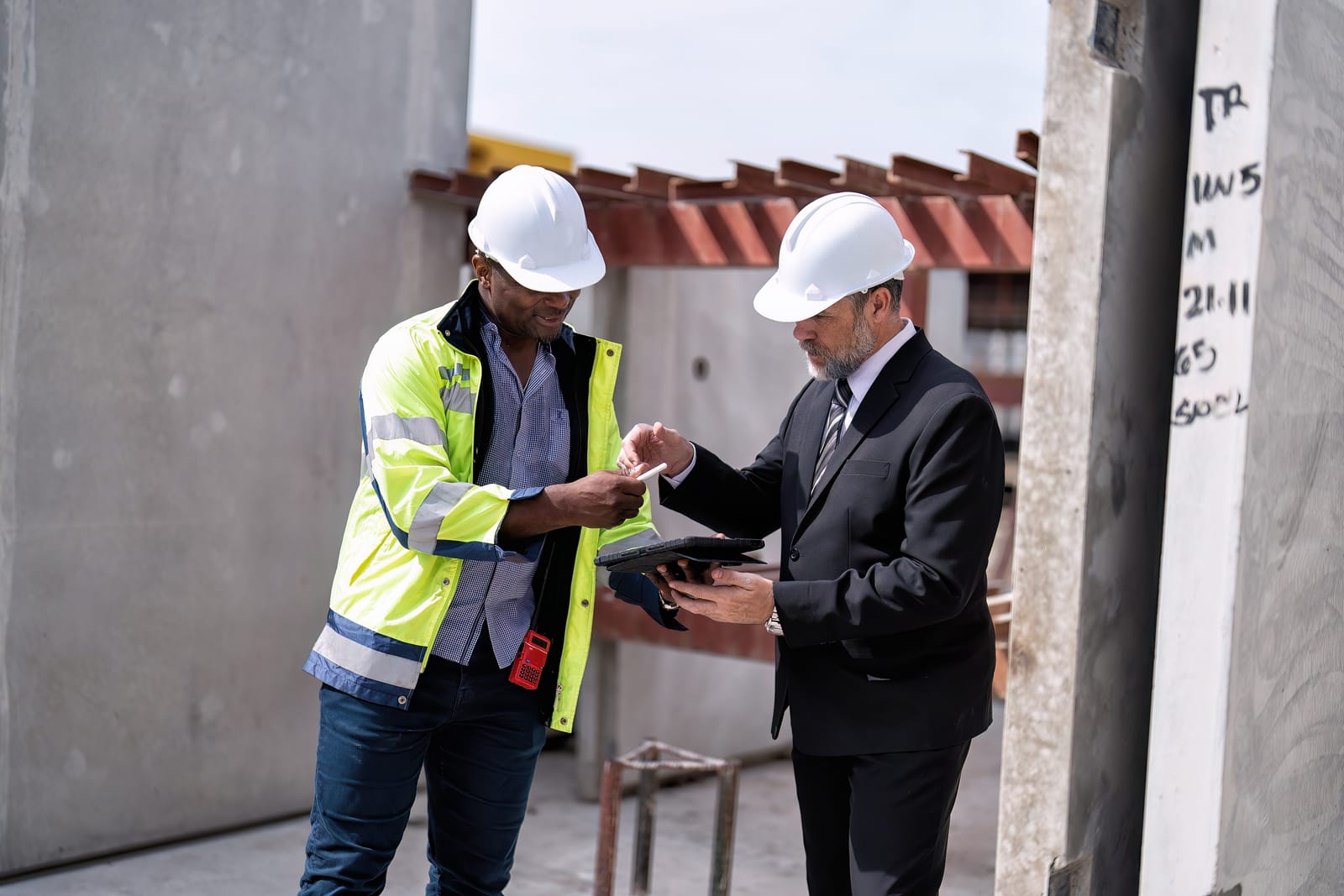 Construction site manager with tablet on Ghana project